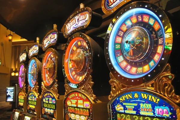 Multiple card game tables with different bet levels on ladang